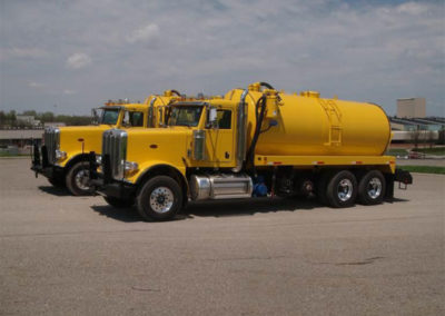 Yellow tank truck with a Fruitland pump